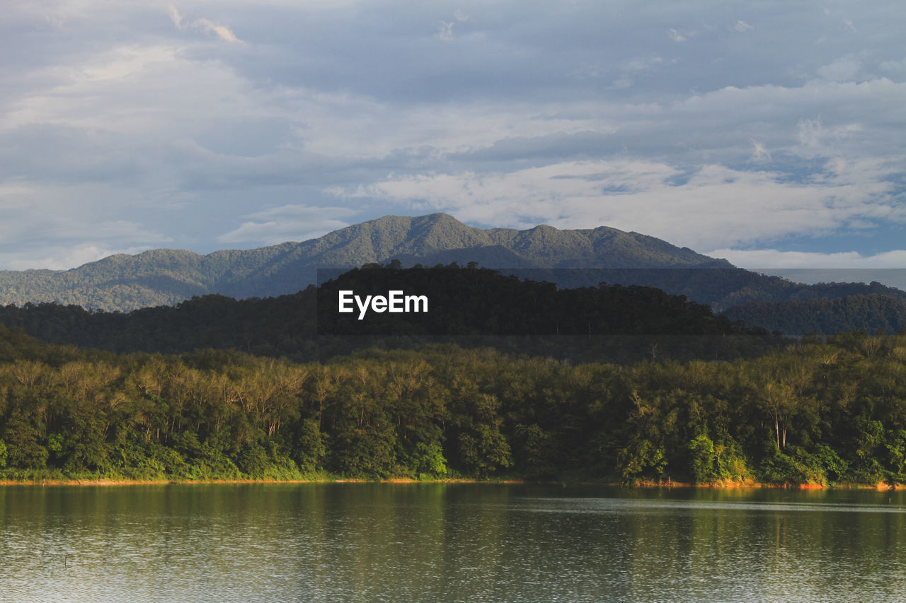 Scenic view of lake and mountains against sky