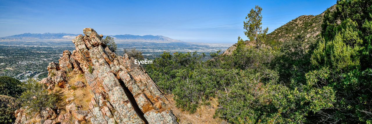 Panoramic view of rocks and mountains against sky