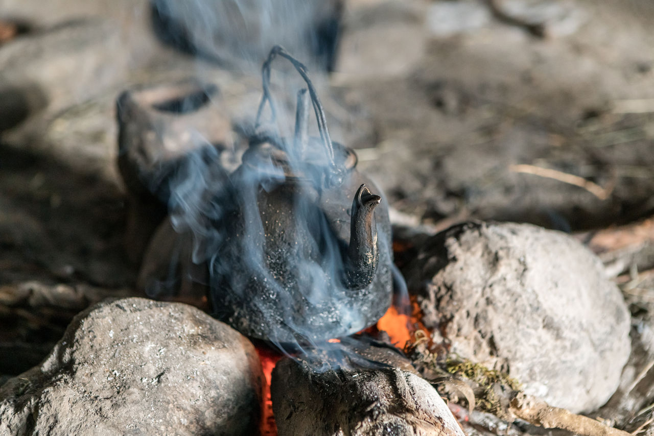 Close-up of tea cooking on fire