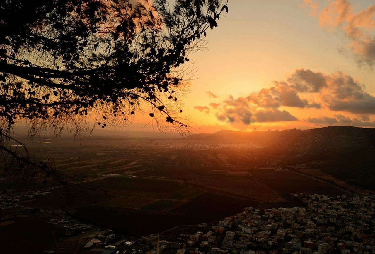 Scenic view of landscape against sky during sunset