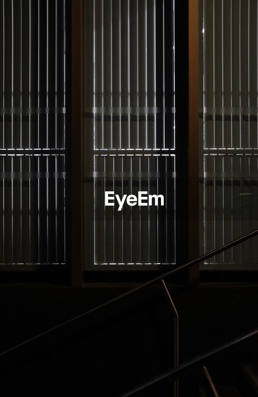 architecture, no people, indoors, metal, light, interior design, line, built structure, window covering, building, pattern, darkness, railing