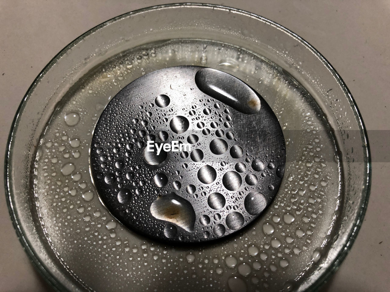 High angle view of wet coffee in container