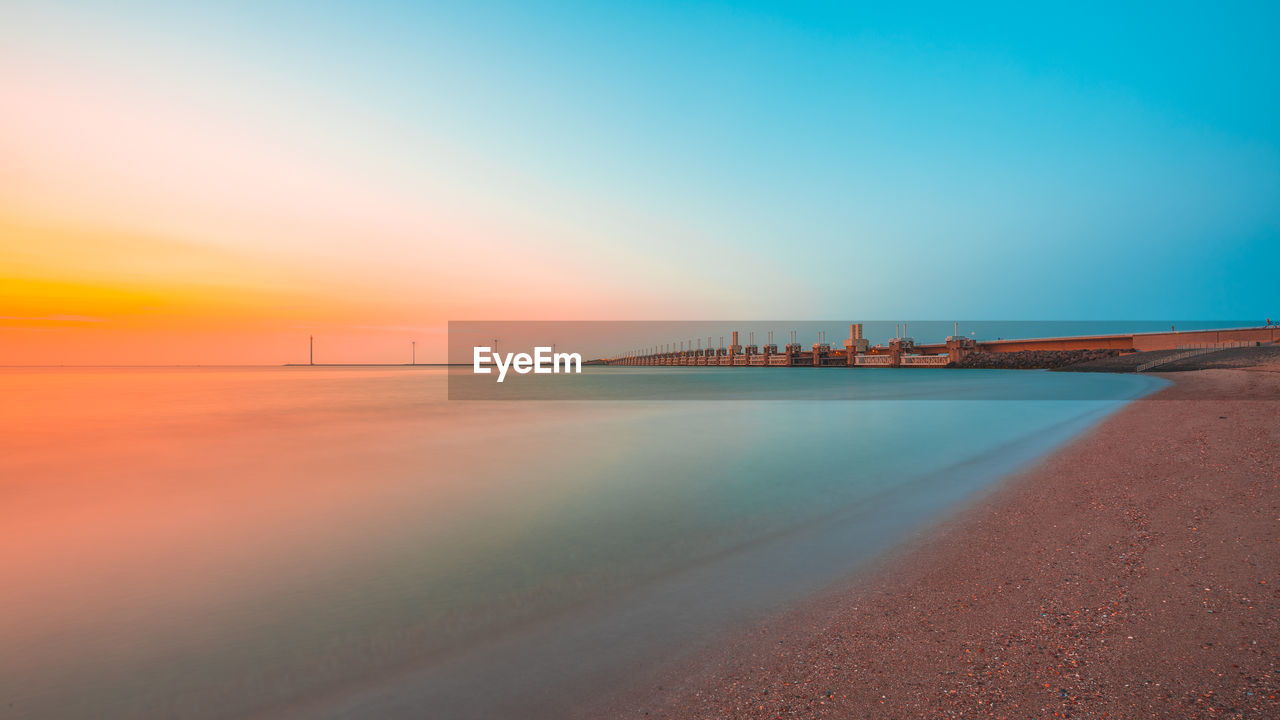 Scenic view of sea against sky during sunset