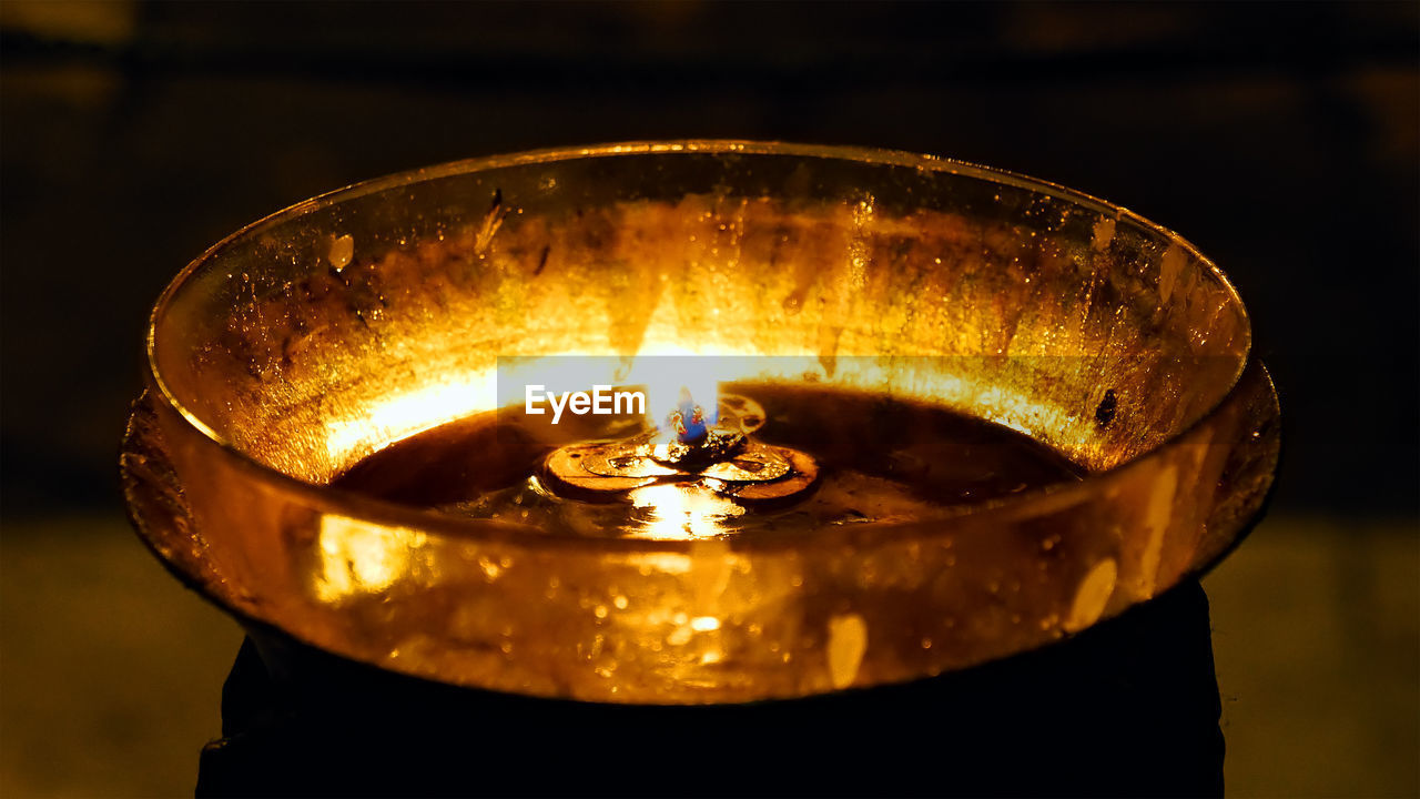 Close-up of illuminated diya