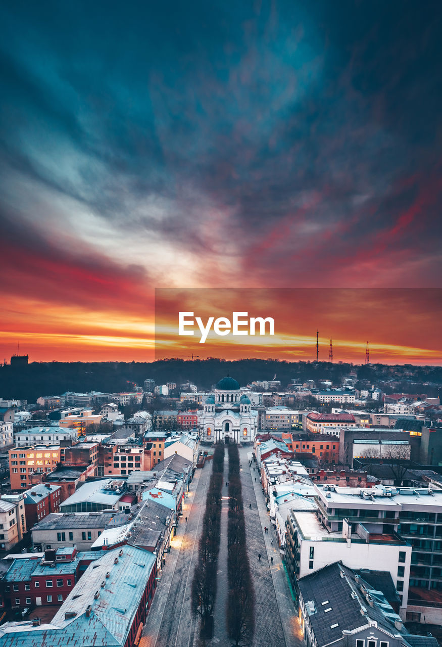 High angle view of buildings in city against sky during sunset