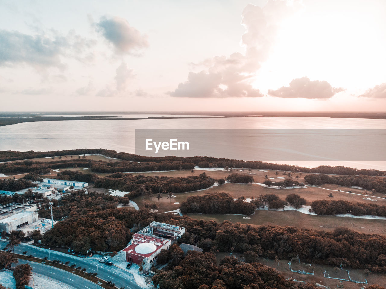 High angle view of townscape by sea against sky