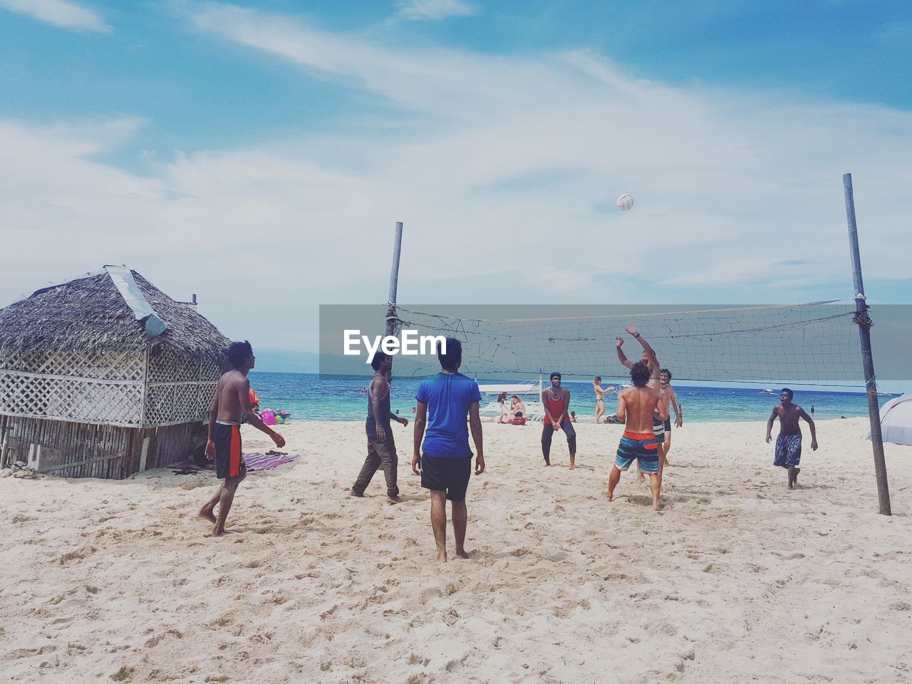 PEOPLE PLAYING ON BEACH