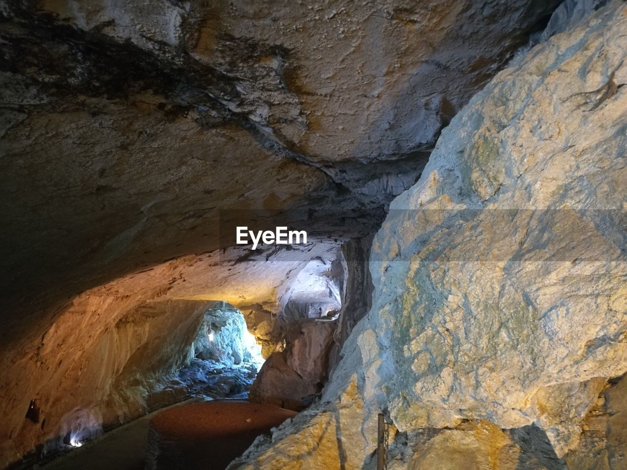 VIEW OF CAVE FROM ROCK