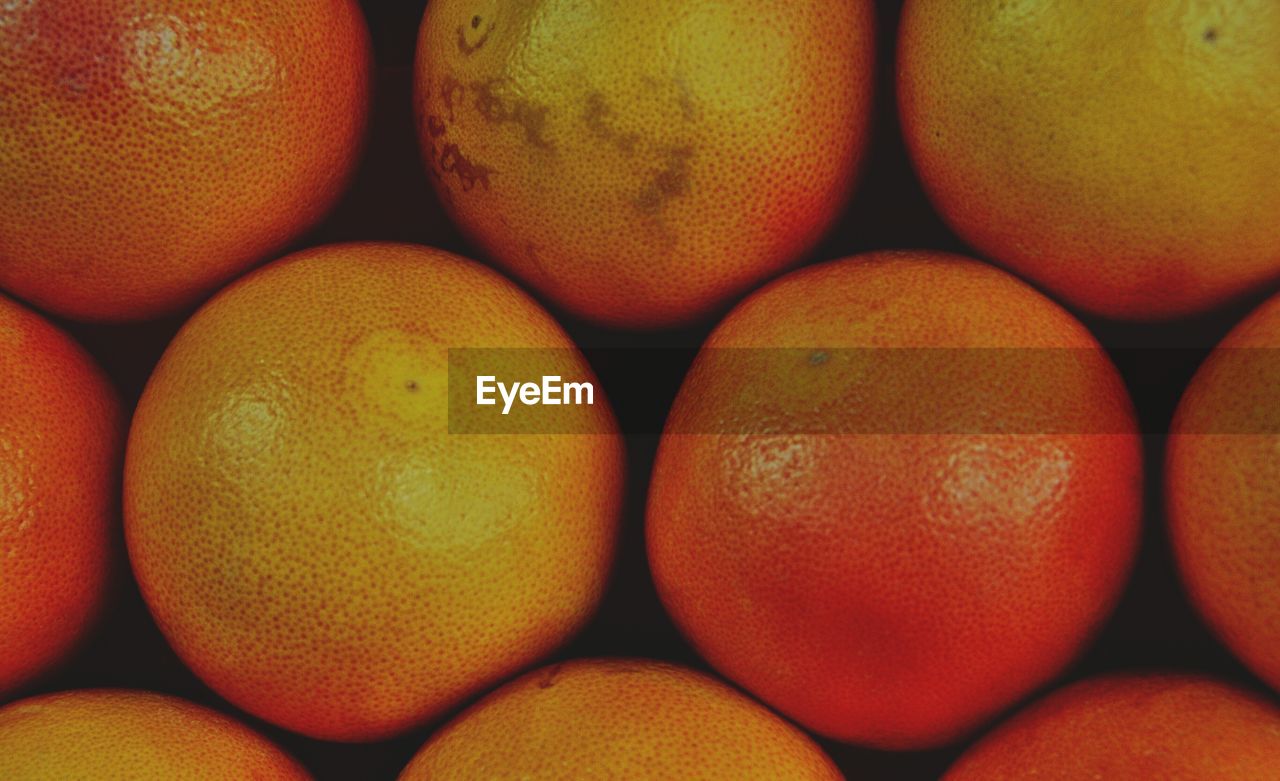 Full frame of oranges on table