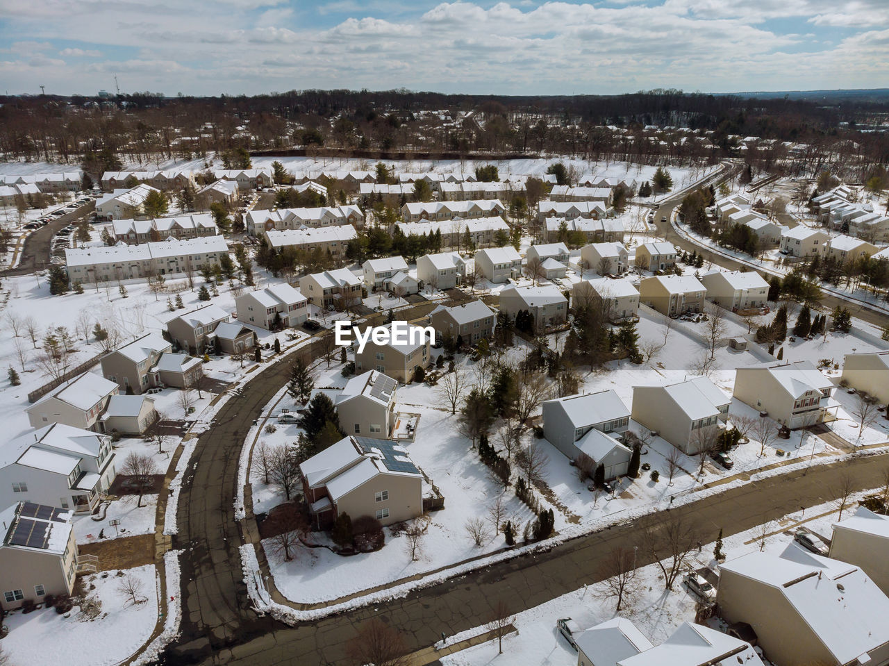 HIGH ANGLE VIEW OF SNOW COVERED HOUSES