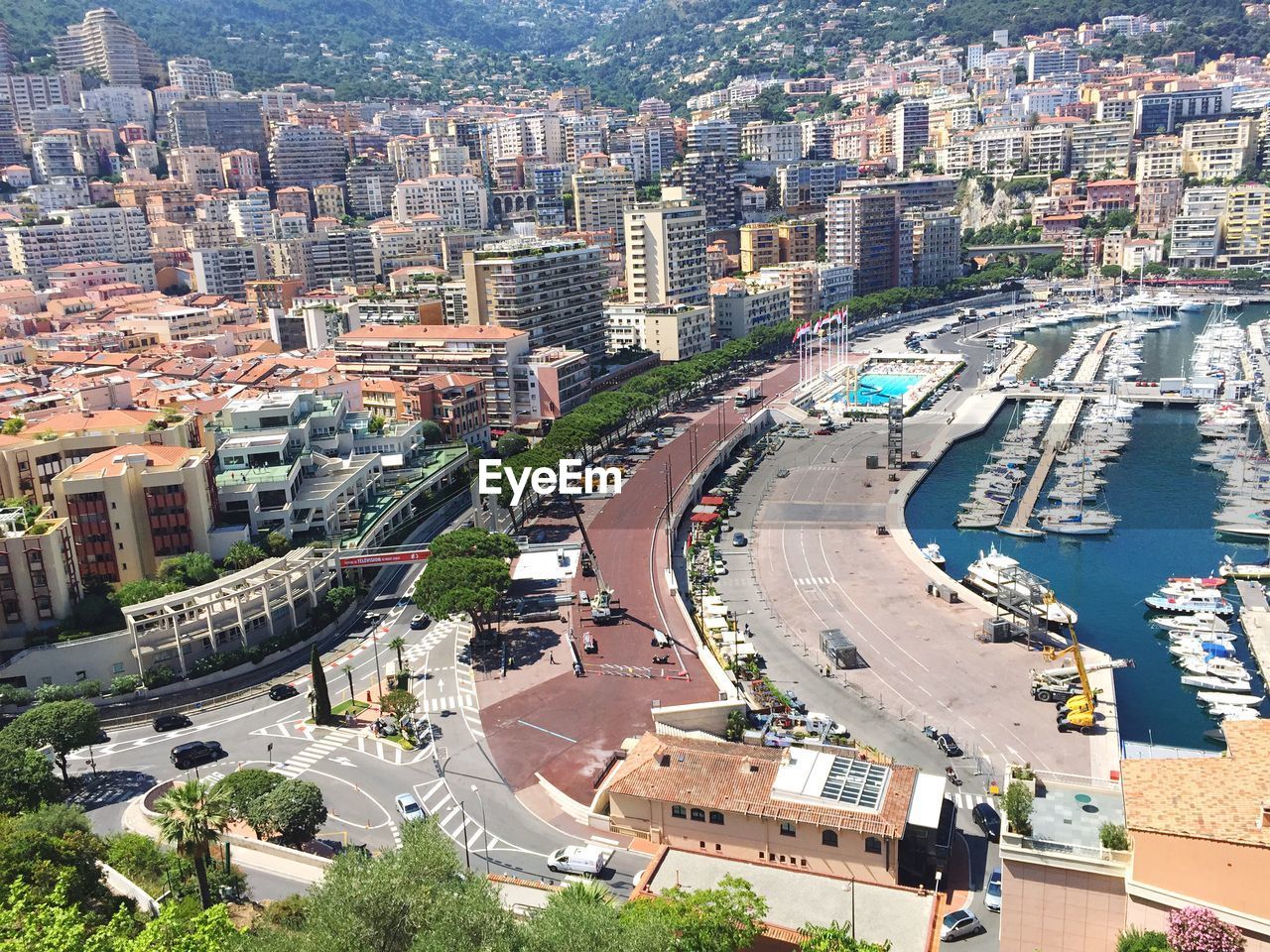 High angle view of harbor by cityscape