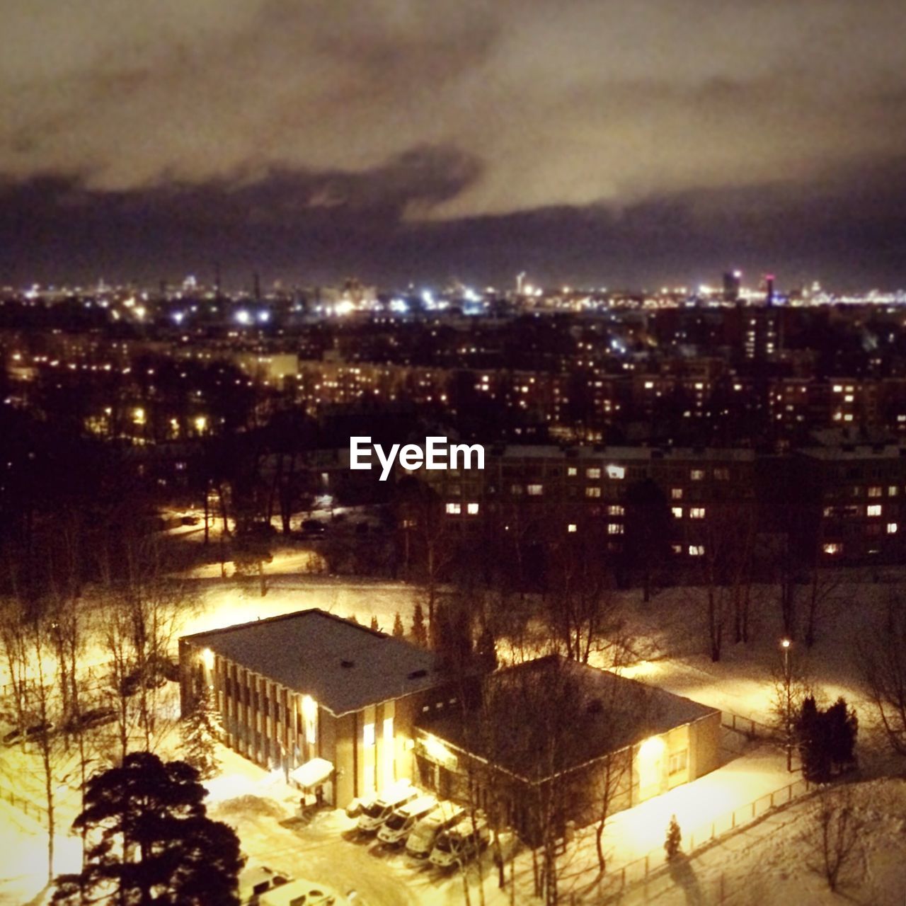 ILLUMINATED CITYSCAPE AT NIGHT