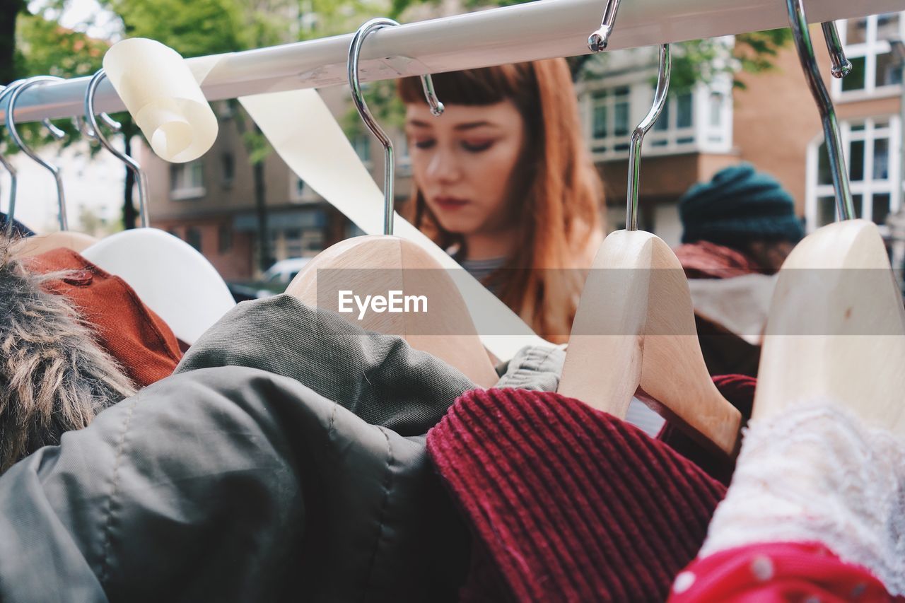 Close-up of young woman shopping outdoors