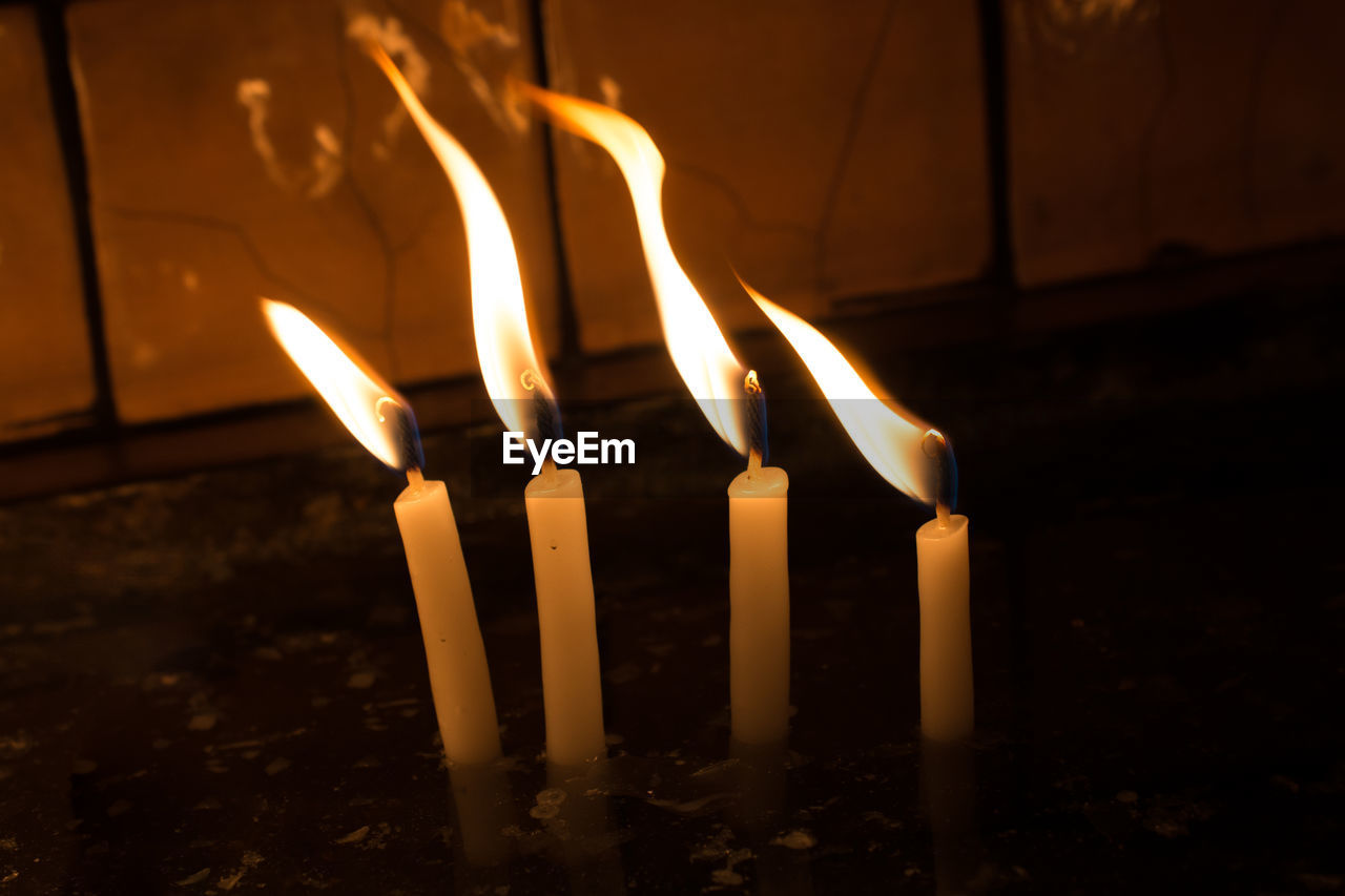 Close-up of burning candle