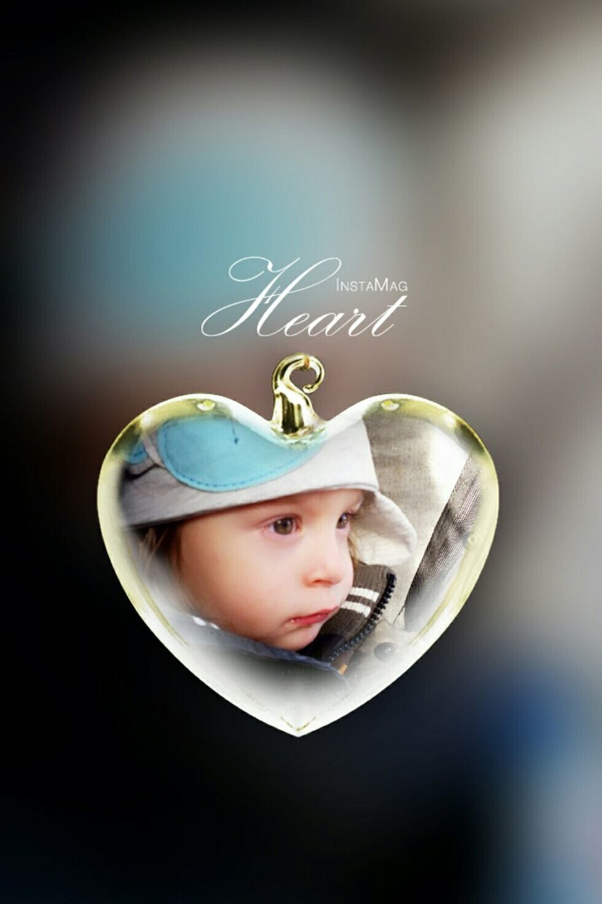 CLOSE-UP OF BOY WEARING HAT