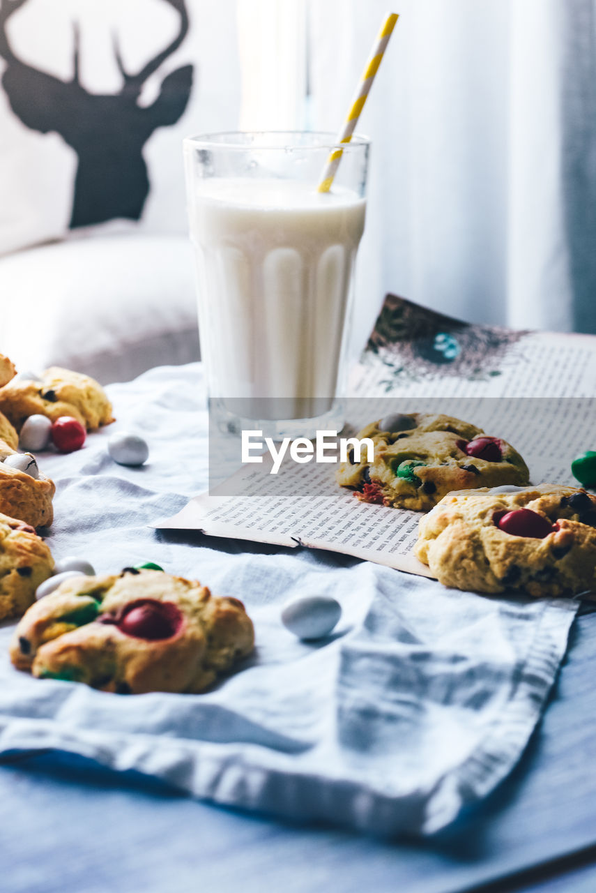 Close-up of cookies and milk on table