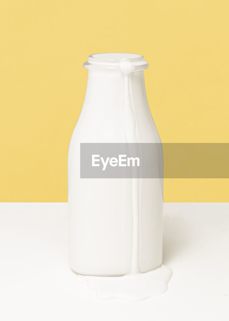Close-up of milk bottle on table