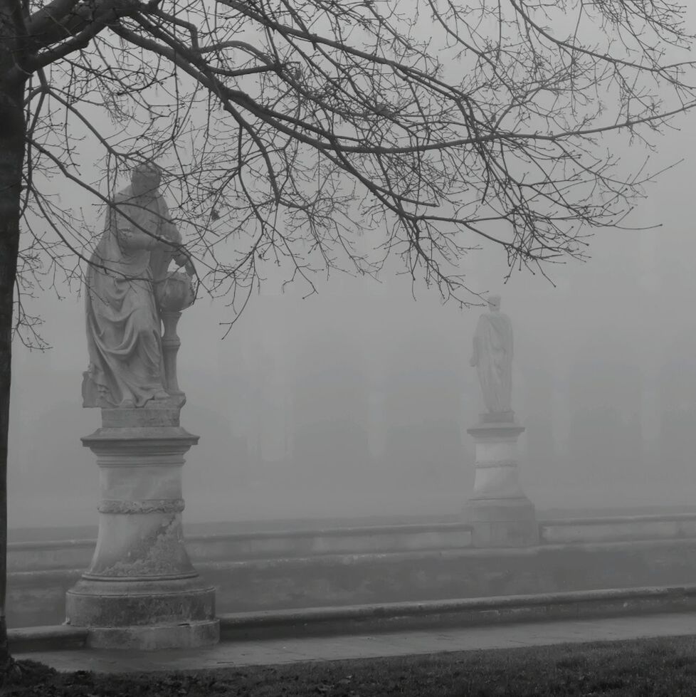 STATUE OF WOMAN IN THE BACKGROUND