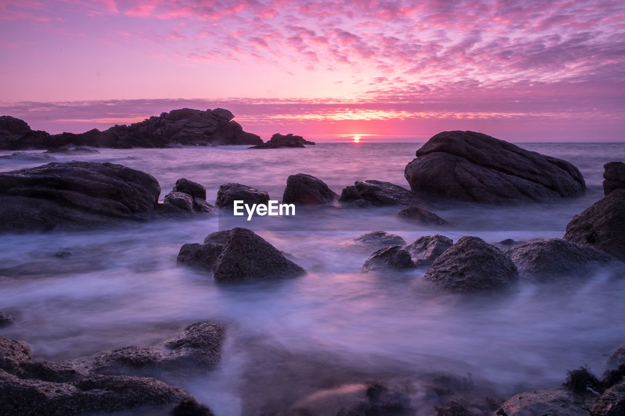 Scenic view of dramatic sky over sea