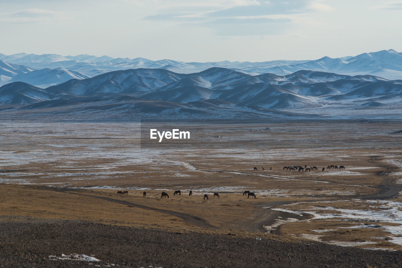 Scenic view of mountains against sky during winter