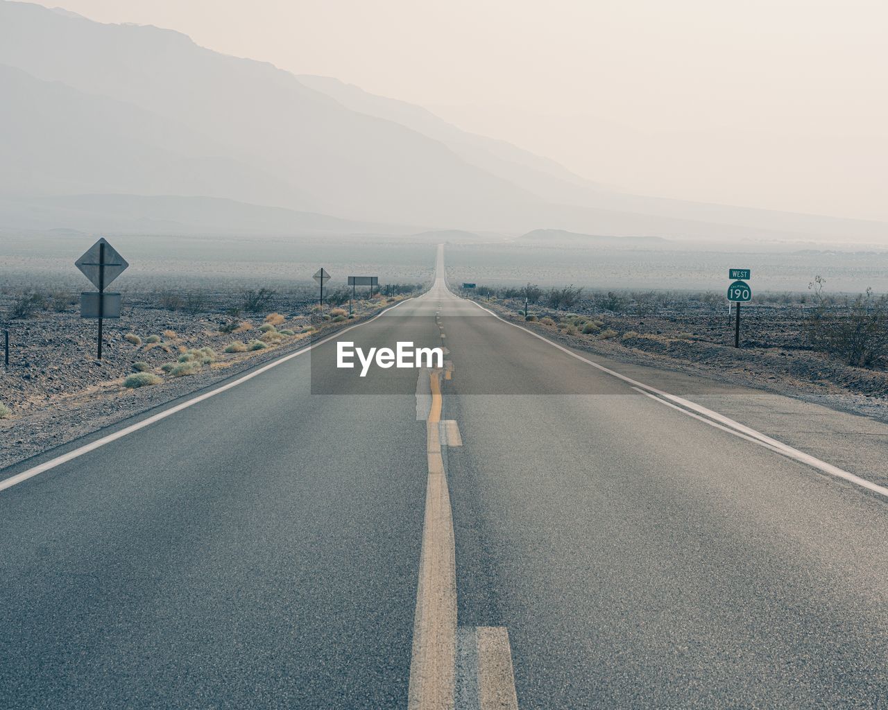 Empty road against sky