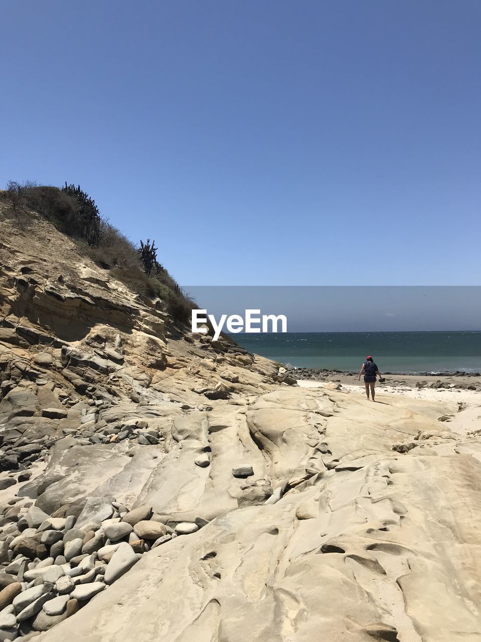 Scenic view of beach against clear sky