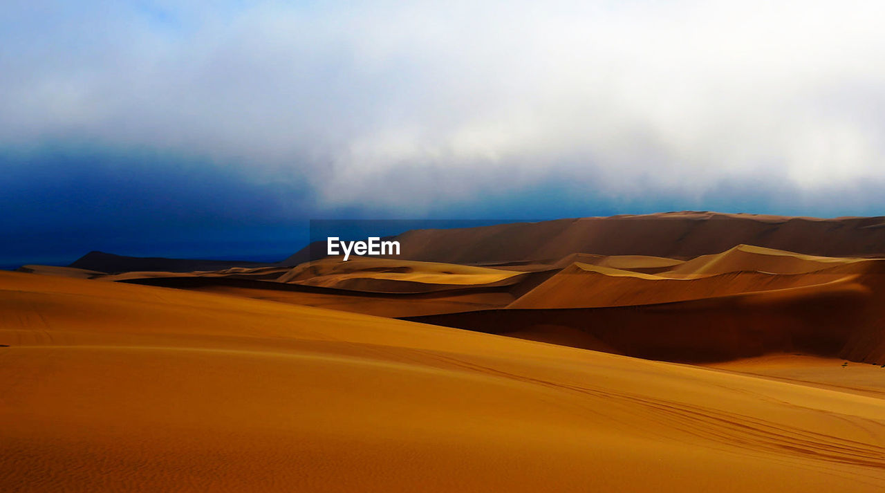 Scenic view of desert against sky