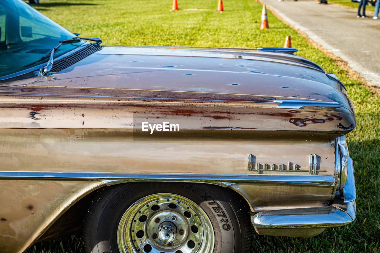 VIEW OF CAR PARKED ON LAND