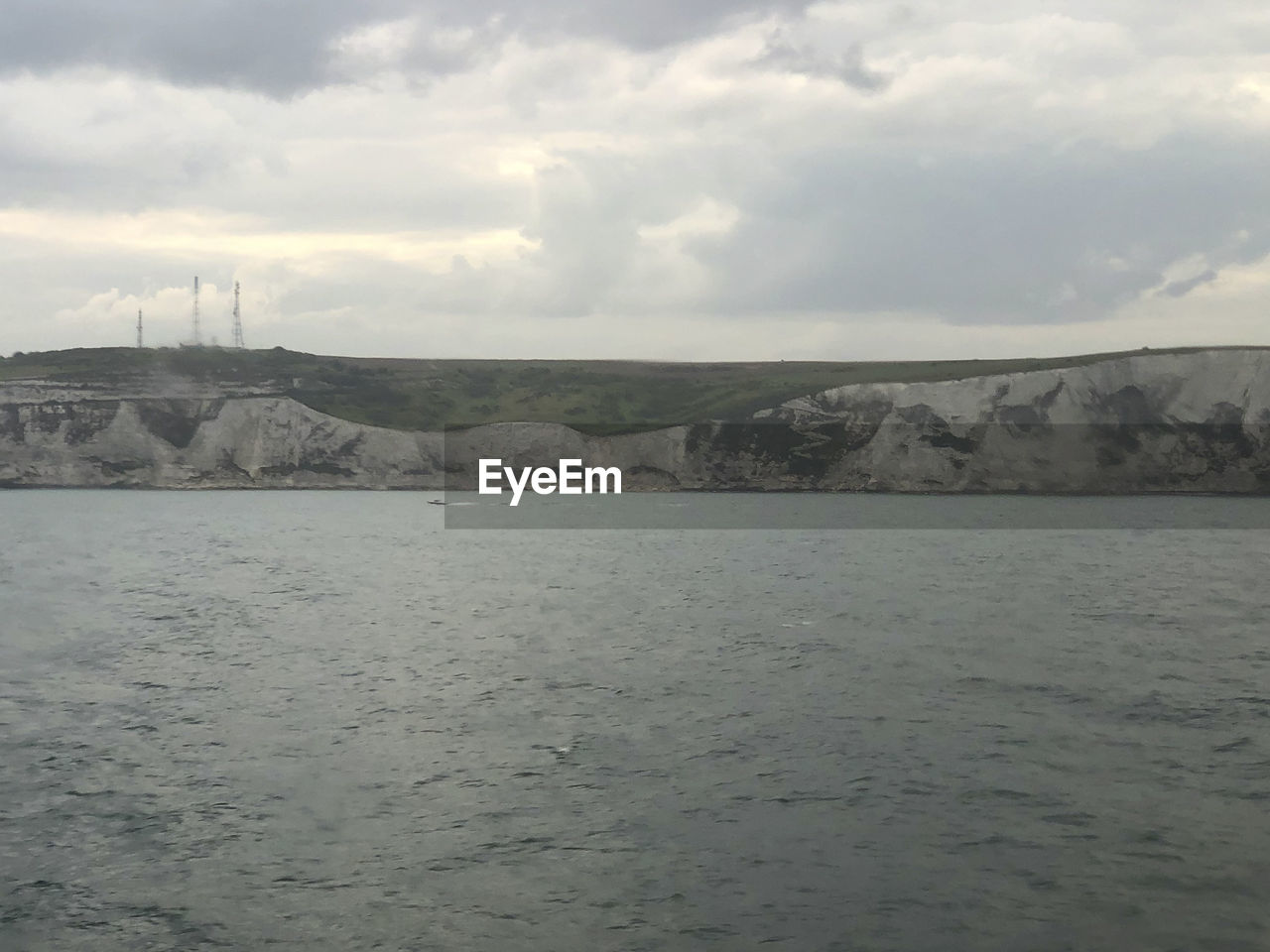 SCENIC VIEW OF SEA AND LAND AGAINST SKY