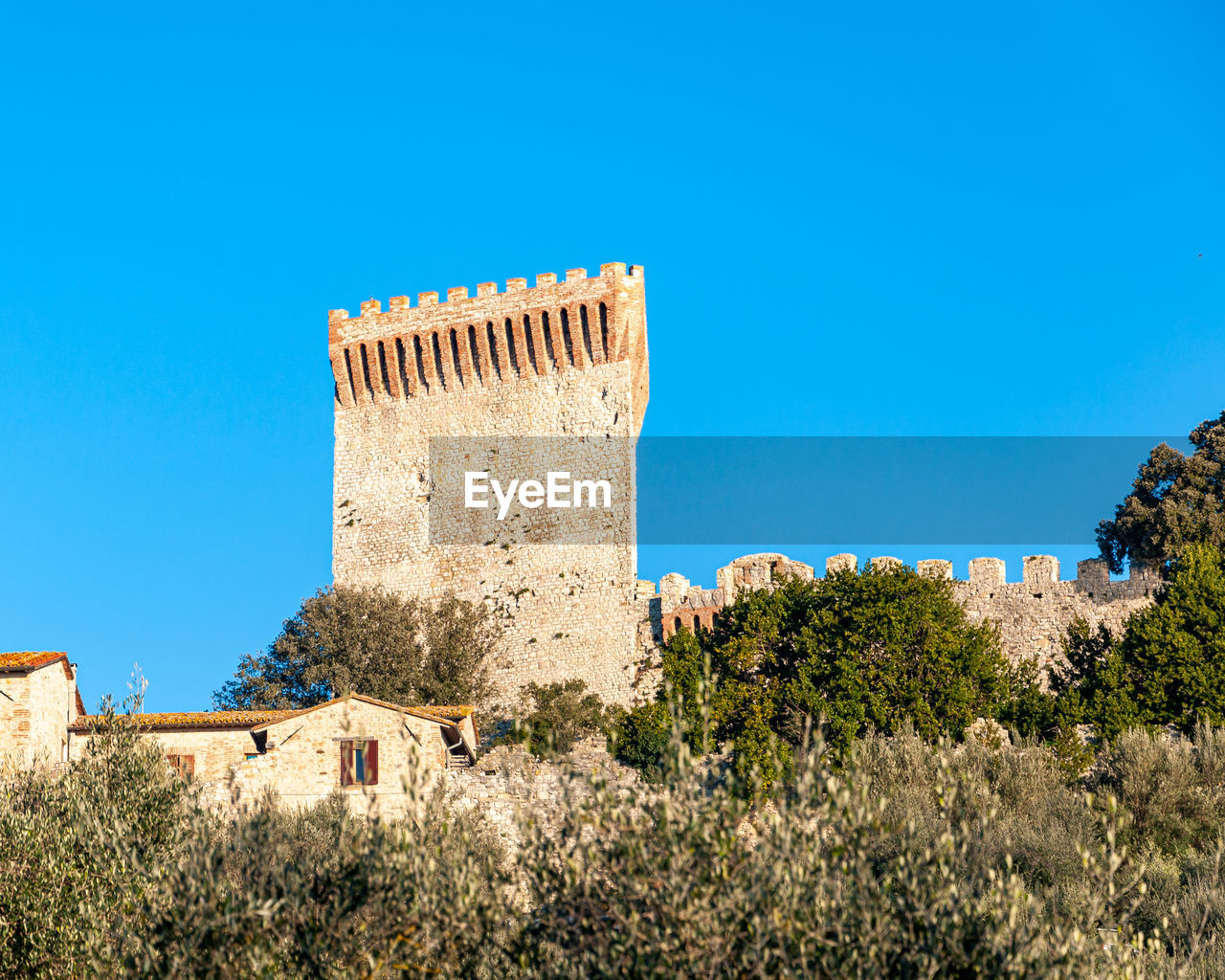 LOW ANGLE VIEW OF FORT AGAINST BLUE SKY