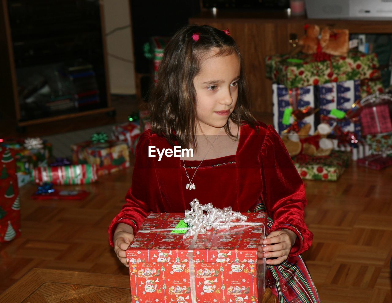 Portrait of a girl with christmas box