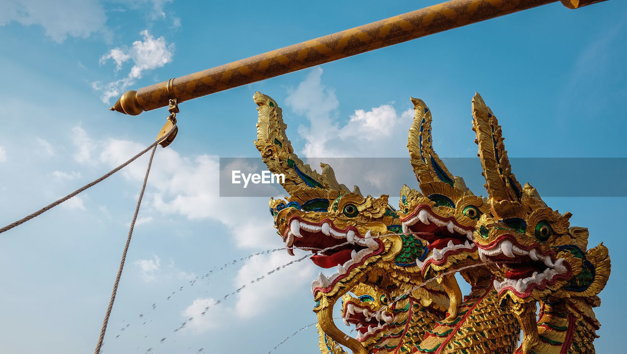 Low angle view of statue against sky