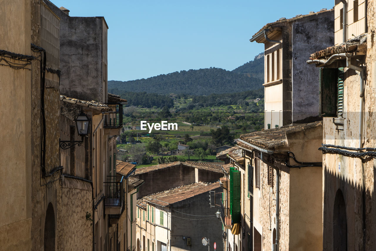 Buildings in town against sky