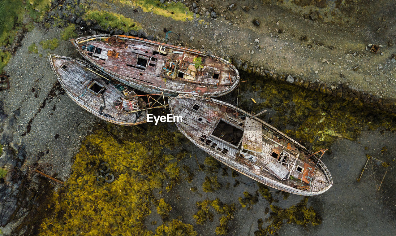 High angle view of abandoned boats on land