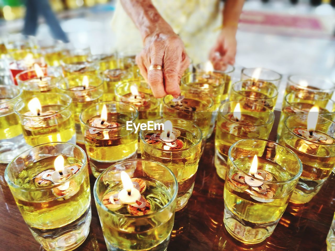 CLOSE-UP OF WINE BOTTLES ON TABLE