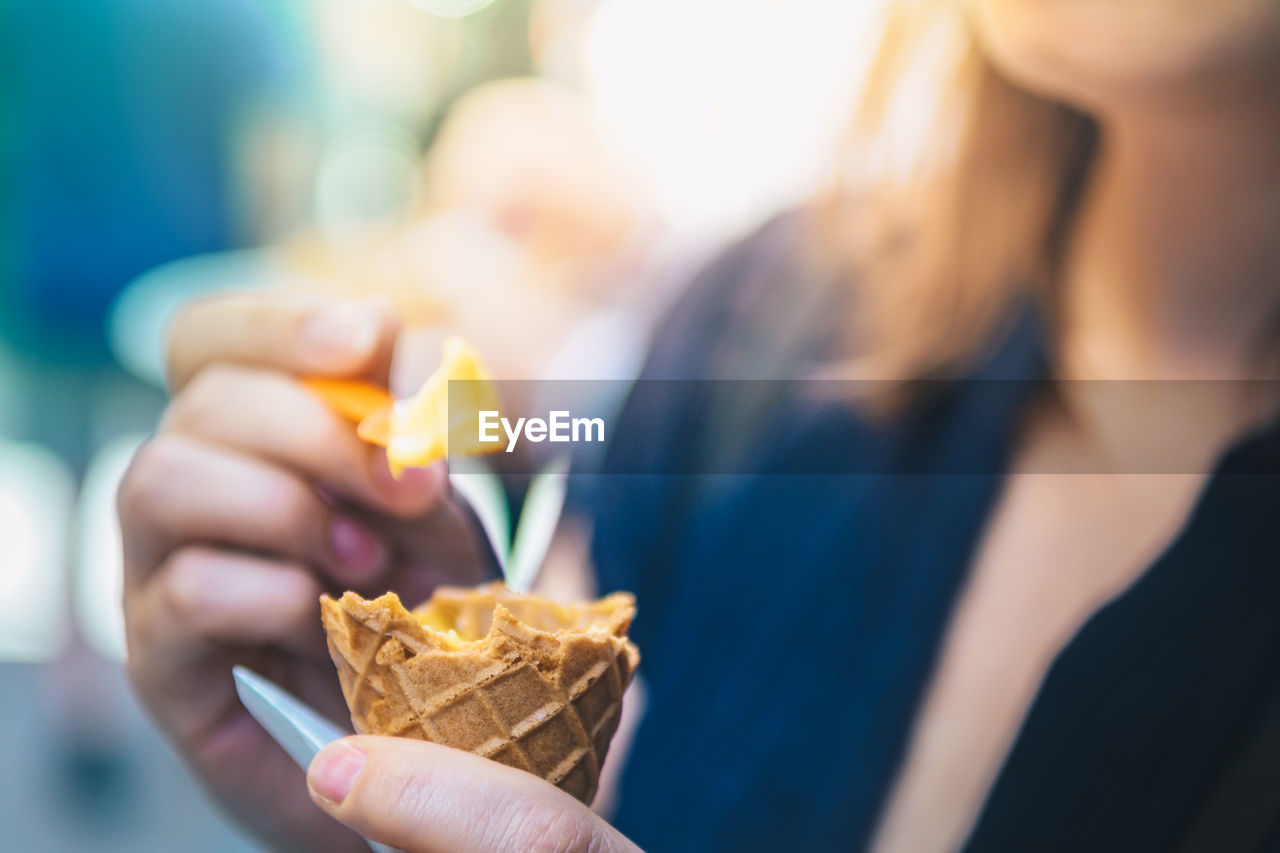 Close-up of woman having ice cream