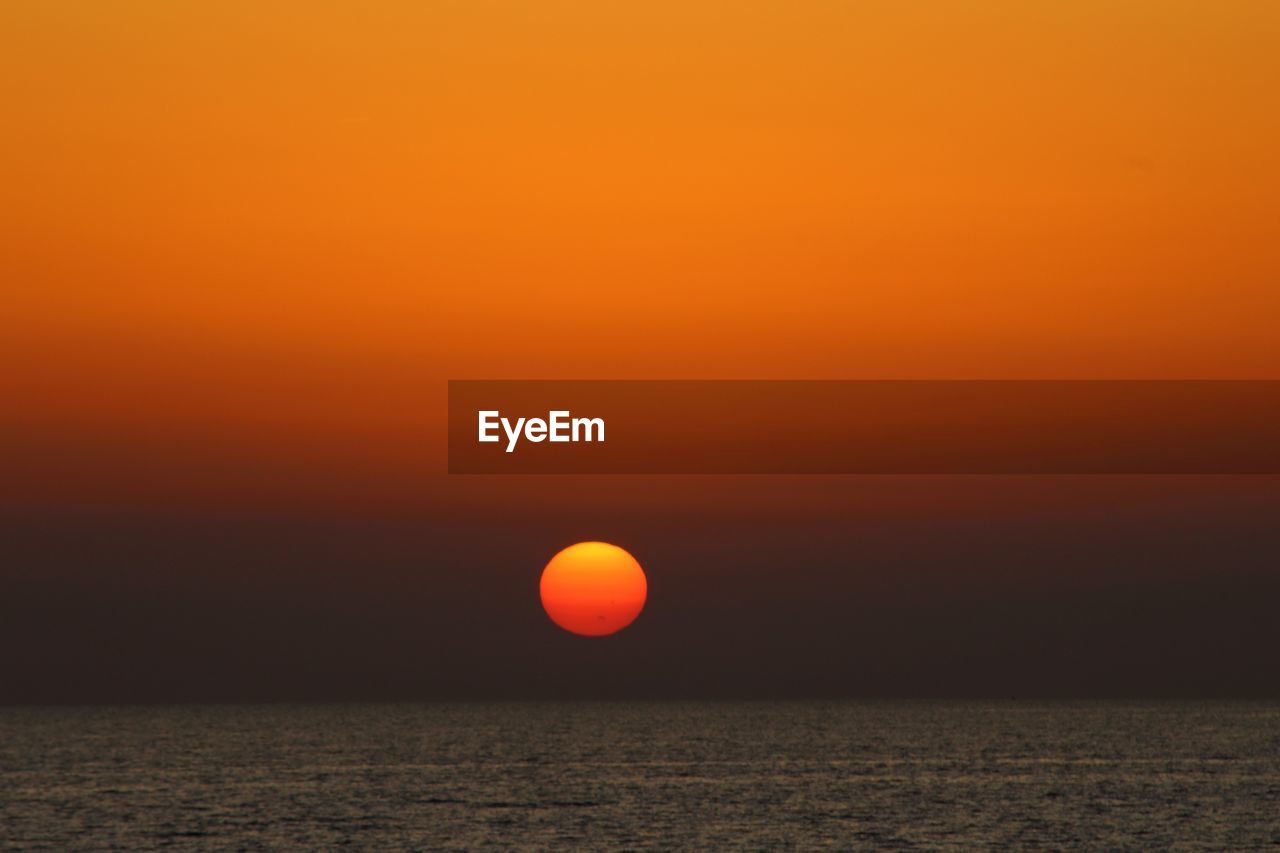 SCENIC VIEW OF SEA AGAINST ROMANTIC SKY