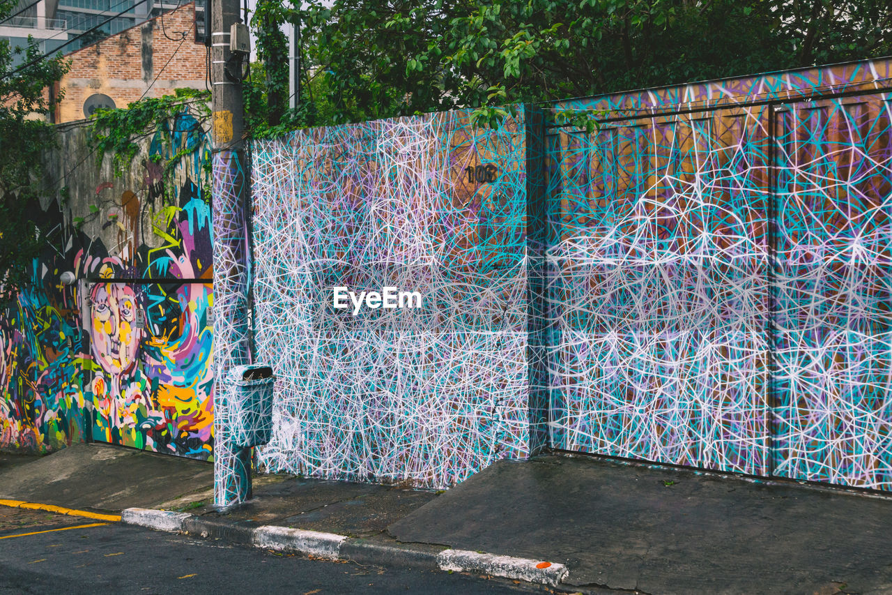 GRAFFITI ON WALL OF TREES