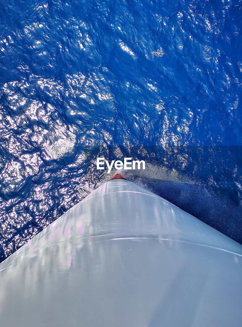 Aerial view of a ships bow in blue sea