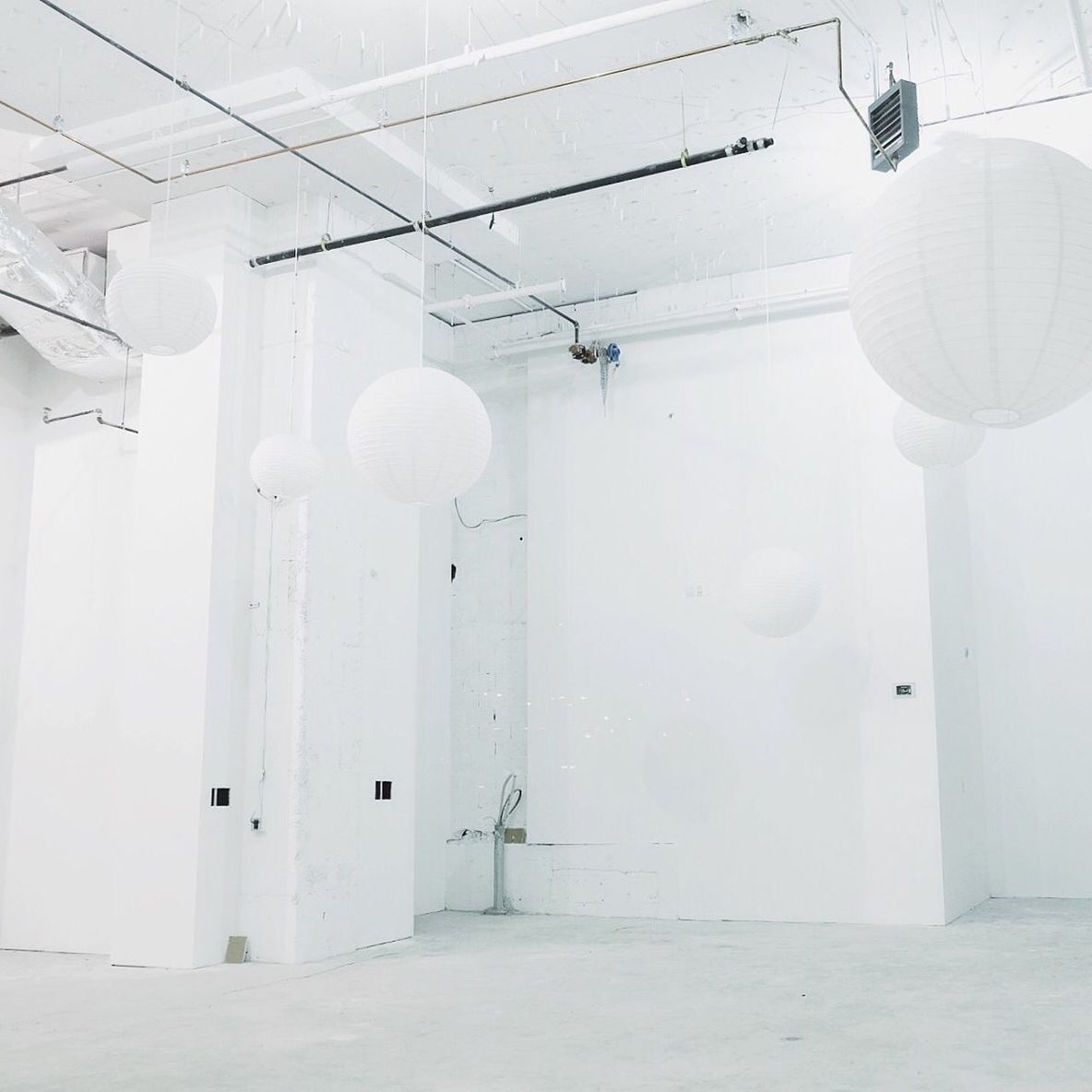 Empty domestic room with paper lanterns