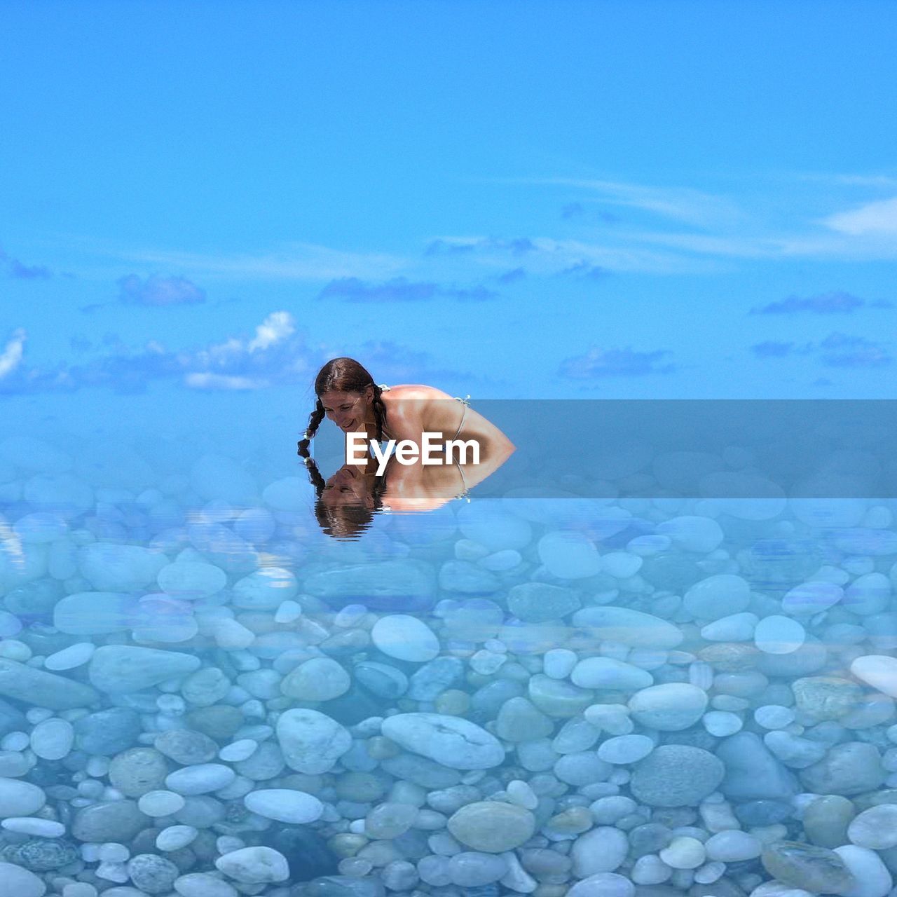 WOMAN SWIMMING IN SEA