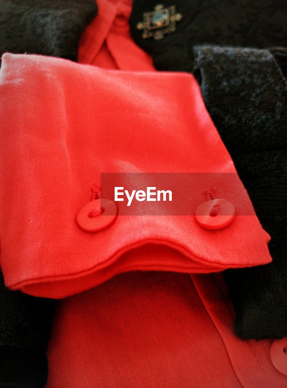 Close-up of red button down shirt