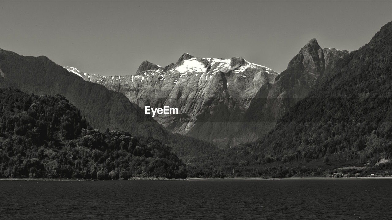 SCENIC VIEW OF MOUNTAINS AGAINST SKY DURING WINTER