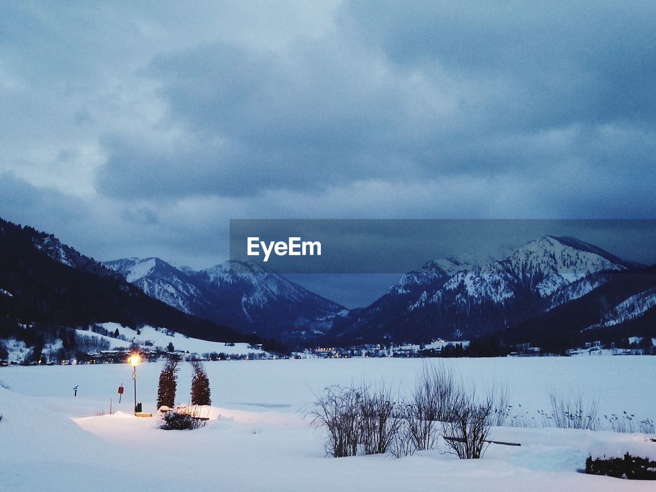 Scenic view of snow covered mountains against sky