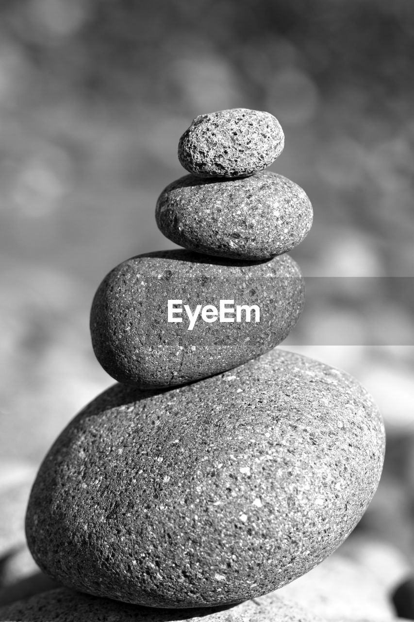 CLOSE-UP OF STONE STACK ON PEBBLES