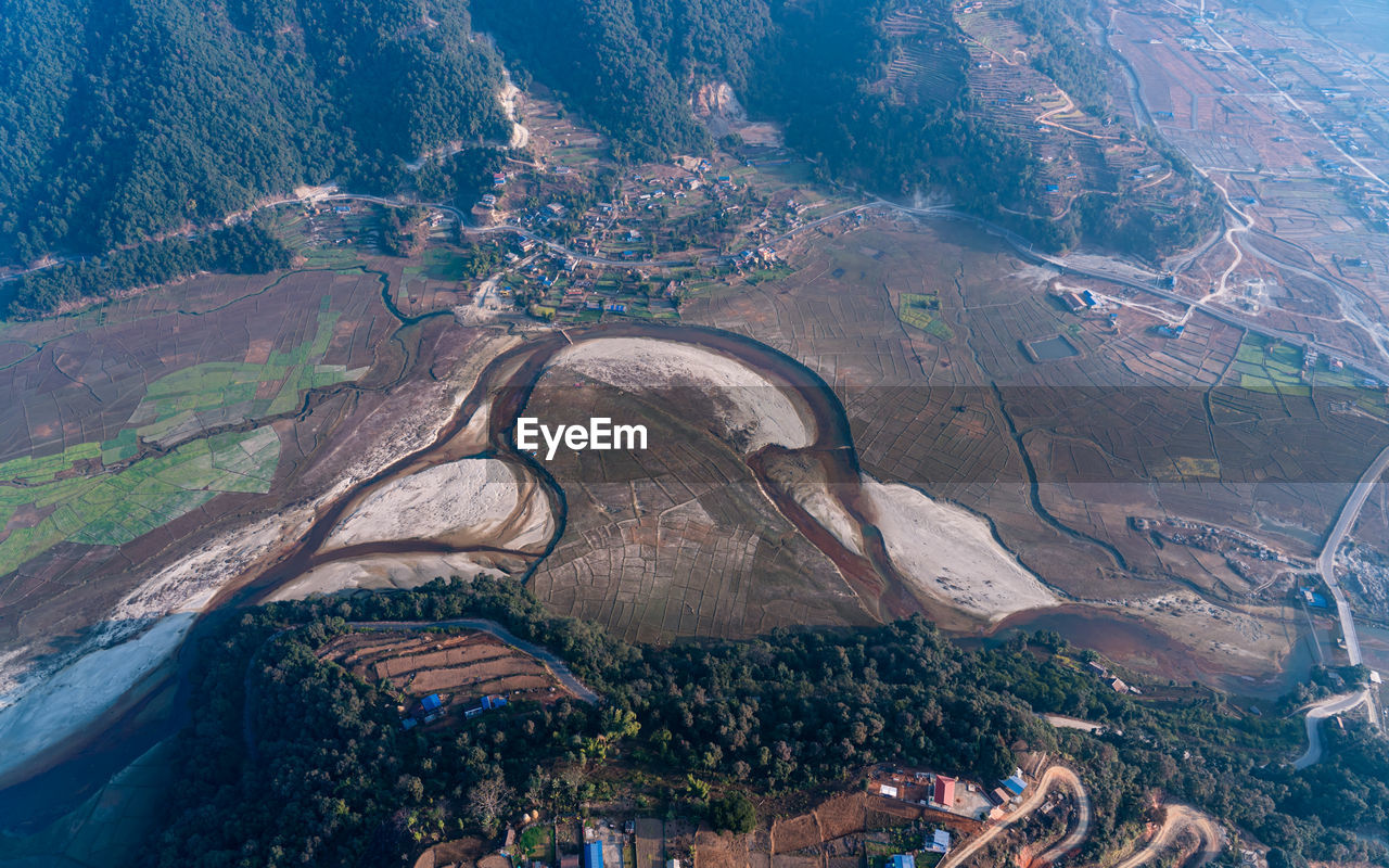 aerial photography, environment, landscape, aerial view, land, scenics - nature, nature, mountain, beauty in nature, high angle view, mountain range, water, outdoors, no people, travel, travel destinations, day, bird's-eye view, rural scene, social issues, architecture, transportation, non-urban scene, tranquility, agriculture
