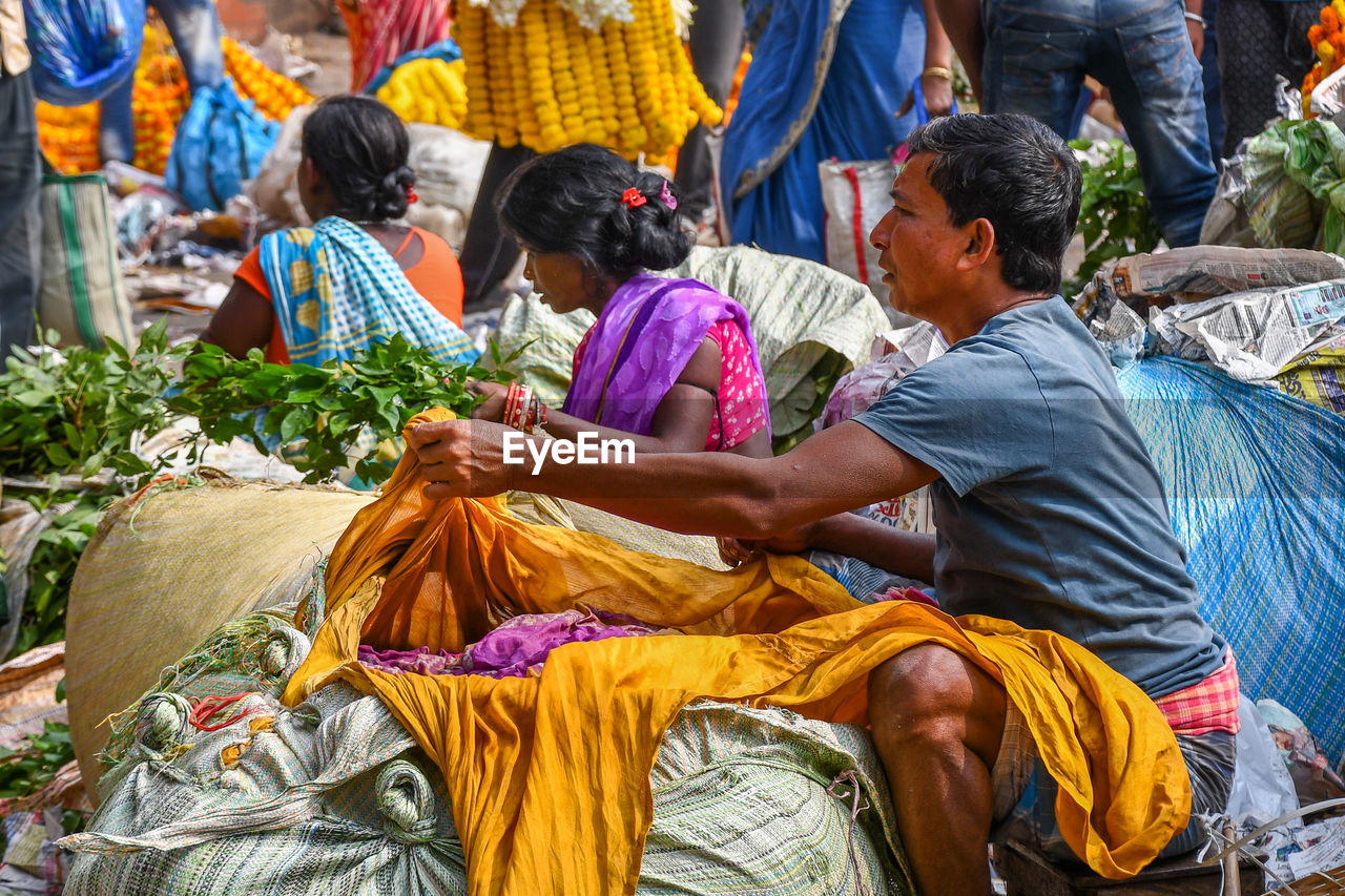 GROUP OF PEOPLE IN MARKET