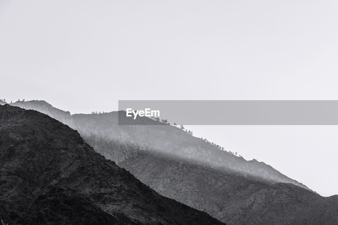 Scenic view of mountains against clear sky