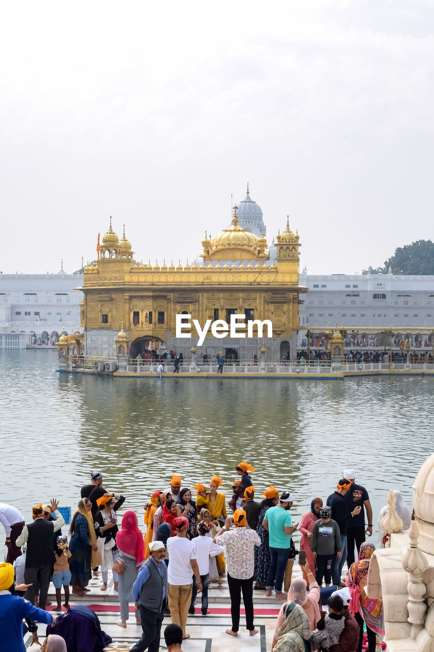 Amritsar, india - february 26 2023 - unidentified devotees from various parts at golden temple