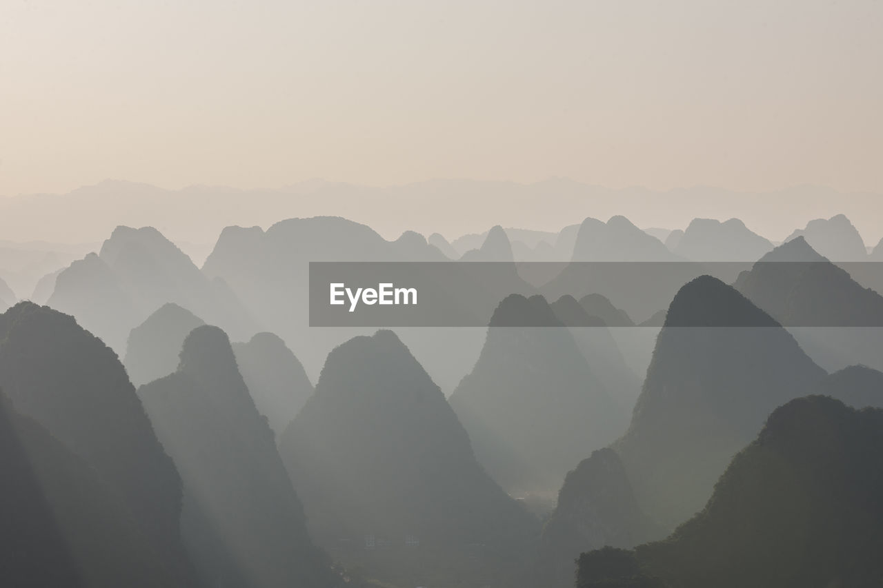 Limstone mountains in the mist around yangshuo in china